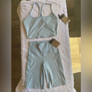 The North Face 9 inch short and crop tank set. Both size S. NWT color,beta blue